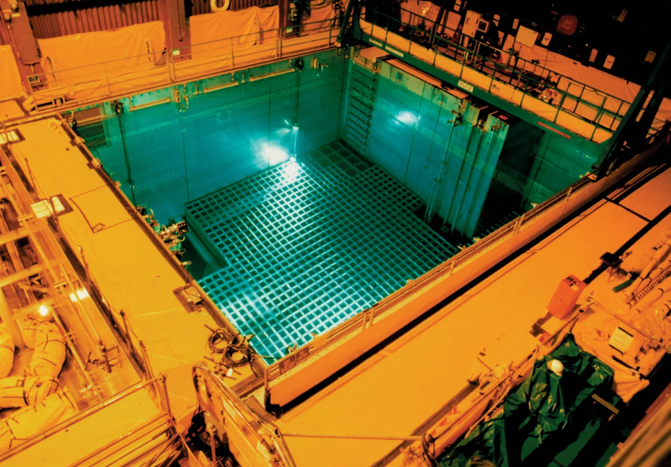 Spent fuel storage pool at San Onofre. Storage racks are visible beneath the water, surrounded by service walkways.